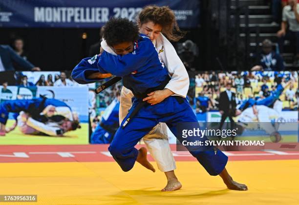France's Marie-Eve Gahie and Independent athlete Madina Taimazova compete in the women's under 70 kg final during the European Judo Championships...