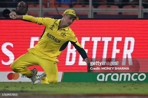 Australia's Marnus Labuschagne takes the catch to dismiss England's Chris Woakes during the 2023 ICC Men's Cricket World Cup one-day international...