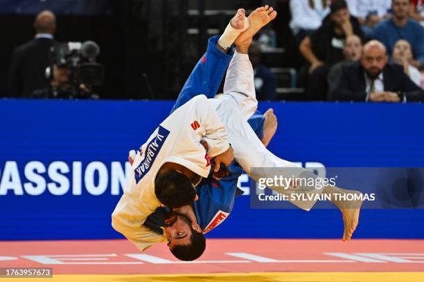 Turkey's Vedat Albayrak throws Georgia's Tato Grigalashvili to make an ippon during the men's under 81 kg final during the European Judo...