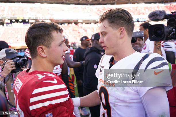 Brock Purdy of the San Francisco 49ers talks with Joe Burrow of the Cincinnati Bengals after the game at Levi's Stadium on October 29, 2023 in Santa...