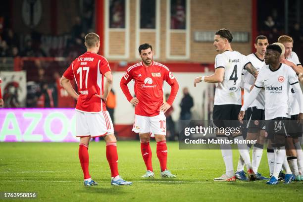 Kevin Behrens, Kevin Volland of 1. FC Union Berlin, Robin Koch and Aurelio Buta of Eintracht Frankfurt after the game between the 1. FC Union Berlin...