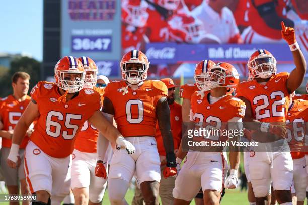 Chapman Pendergrass, Antonio Williams, Wise Segars Jr., and Dee Crayton of the Clemson Tigers walk the field before taking on the Notre Dame Fighting...