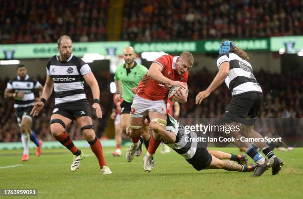 Wales's Jac Morgan is tackled by Barbarian's Lzaia Perses during the Rugby International match between Wales and Barbarians at Principality Stadium...