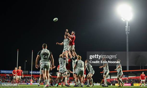 Cork , Ireland - 4 November 2023; Tom Ahern of Munster contests a lineout with James Benjamin of Dragons during the United Rugby Championship match...