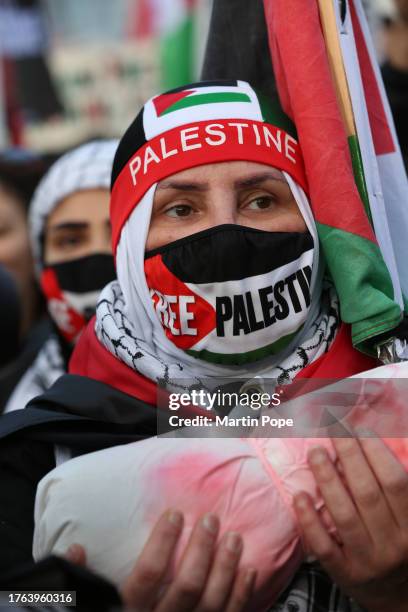 Protester holds a package stained with fake blood to signify the children killed in Gaza during the protest on November 4, 2023 in London, United...