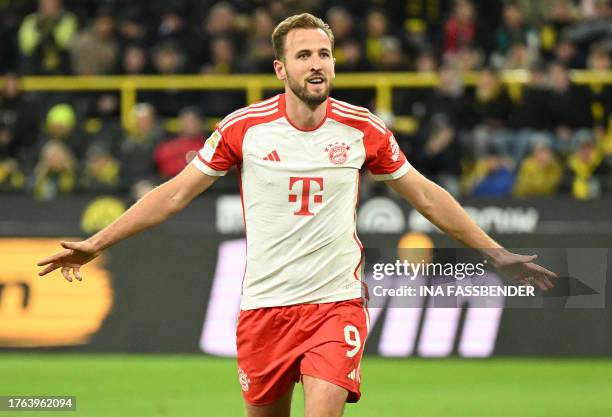 Bayern Munich's English forward Harry Kane celebrates scoring the 0-4 goal during the German first division Bundesliga football match between BVB...