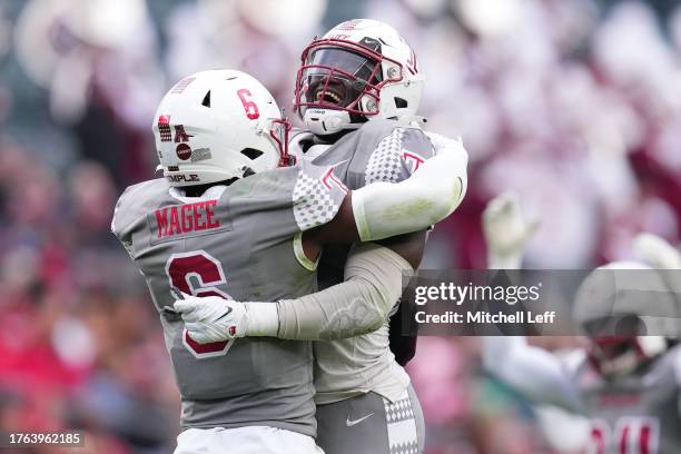 Jordan Magee of the Temple Owls celebrates with Yvandy Rigby after a sack against the Navy Midshipmen in the first half at Lincoln Financial Field on...