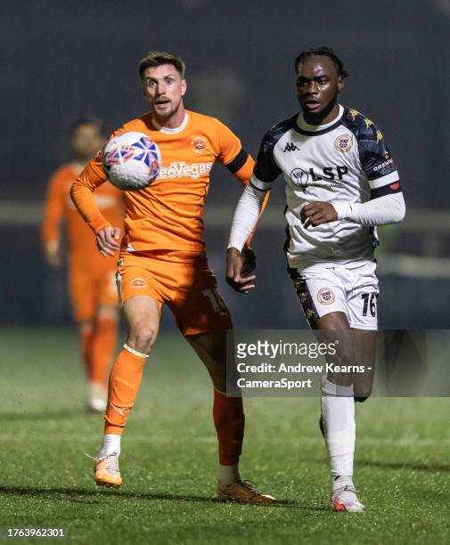 Blackpool's Jake Beesley competing with Bromley's Chinwike Okoli during the Emirates FA Cup First Round match between Bromley and Blackpool at Hayes...