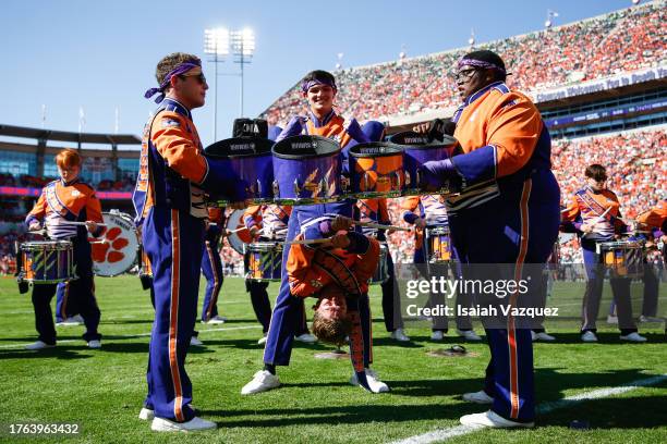 Clemson Tigers Marching Band member plays the quad drums upside down during a break in play as the Notre Dame Fighting Irish take on the Clemson...