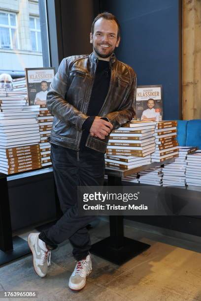Cook Steffen Henssler gifts cookbooks at Restaurant Ahoi on November 4, 2023 in Hamburg, Germany.