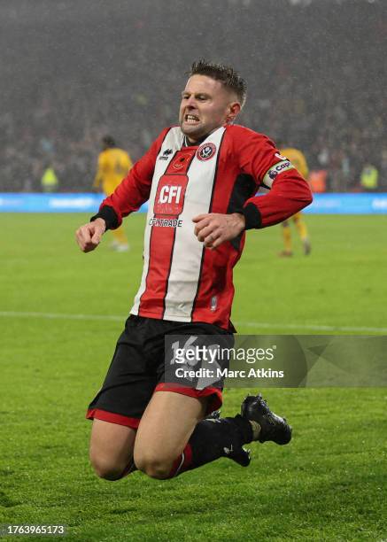 Oliver Norwood of Sheffield United celebrates scoring the winning goal during the Premier League match between Sheffield United and Wolverhampton...