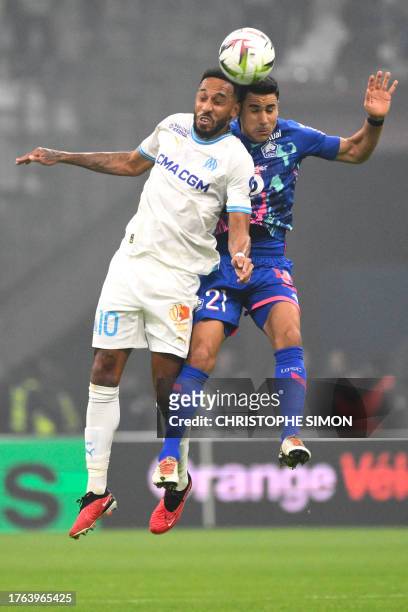 Marseille's French-Gabonese forward Pierre-Emerick Aubameyang and Lille's French midfielder Benjamin Andre fight for the ball during the French L1...