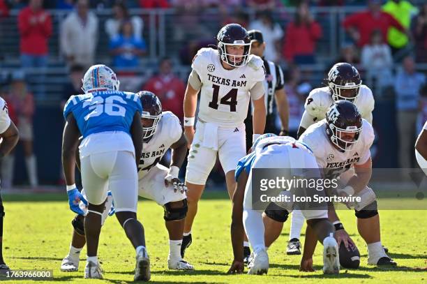 Texas A&M quarterback Max Johnson gives instructions to teammates during the college football game between the Texas A&M Aggies and the Ole' Miss...