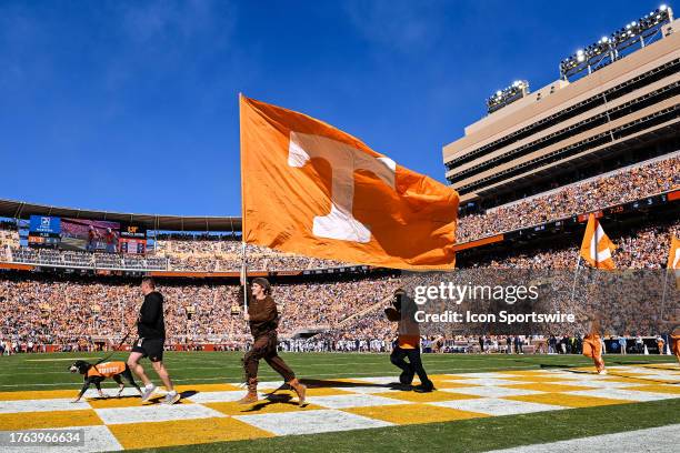 Tennessee Volunteers mascot The Volunteer runs the Power T flag across the end zone during the college football game between the Tennessee Volunteers...