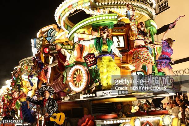 Revellers on floats entertain the crowds as they take part in the Procession through the town during the Bridgwater Guy Fawkes Carnival in south-west...