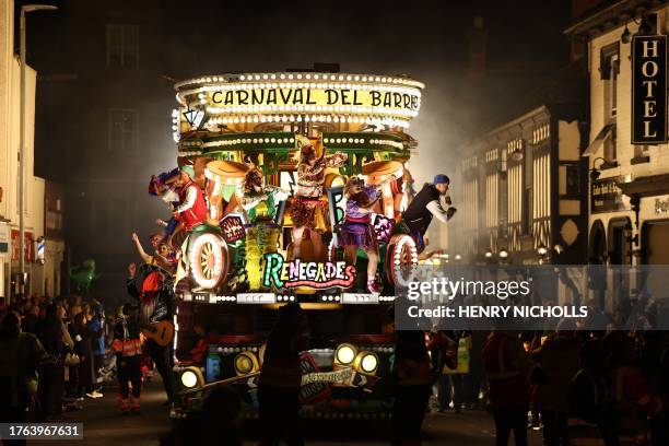 Revellers on floats entertain the crowds as they take part in the Procession through the town during the Bridgwater Guy Fawkes Carnival in south-west...