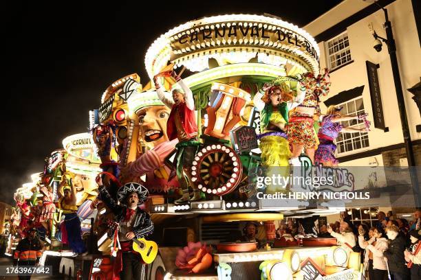 Revellers on floats entertain the crowds as they take part in the Procession through the town during the Bridgwater Guy Fawkes Carnival in south-west...