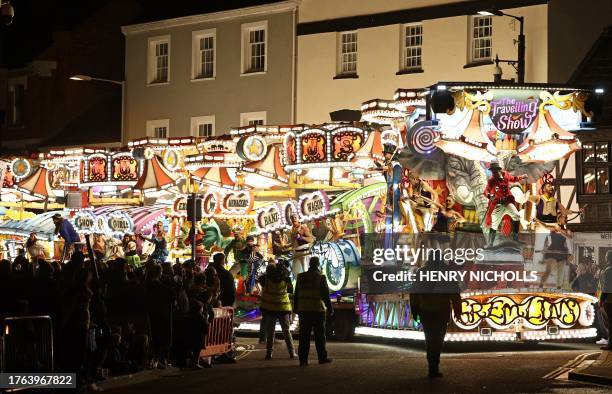 Crowds of onlookers watch the floats pass through the town in the Procession during the Bridgwater Guy Fawkes Carnival in south-west England, on...