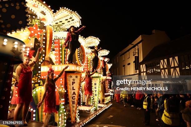 Revellers on floats entertain the crowds as they take part in the Procession through the town during the Bridgwater Guy Fawkes Carnival in south-west...