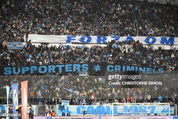 Marseille's supporters hold a banner during the French L1 football match between Olympique Marseille and Lille OSC at the Orange Velodrome Stadium in...