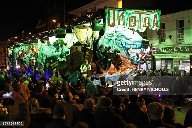 Crowds of onlookers watch the floats pass through the town in the Procession during the Bridgwater Guy Fawkes Carnival in south-west England, on...