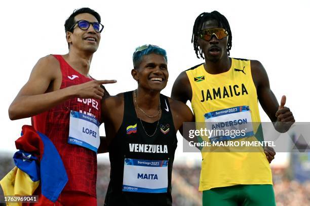 Mexico's Jesus Tonatiu Lopez Alvarez , Venezuela's Jose Antinio Maita Perez and Jamaica's Navasky Anderson pose for a picture after winning the...