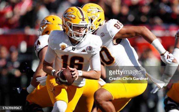 Trenton Bourguet of the Arizona State Sun Devils rolls out to hand off during the first half of their game aginst the Utah Utes at Rice Eccles...