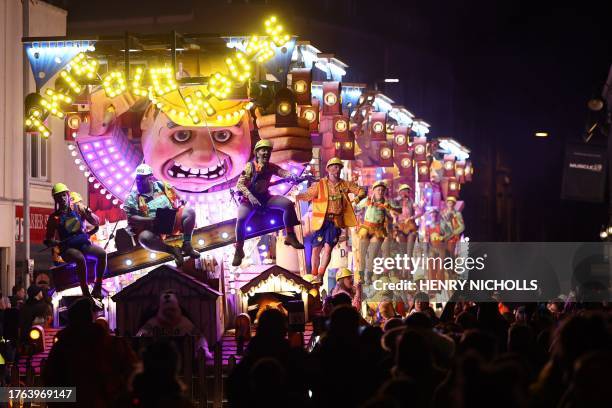 Revellers on floats entertain the crowds as they take part in the Procession through the town during the Bridgwater Guy Fawkes Carnival in south-west...