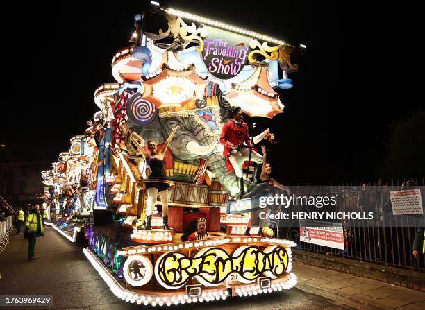 Revellers on floats entertain the crowds as they take part in the Procession through the town during the Bridgwater Guy Fawkes Carnival in south-west...