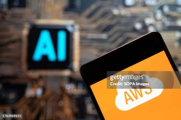 In this photo illustration, the American on-demand cloud computing platform owned by Amazon, Amazon Web Services logo seen displayed on a smartphone...