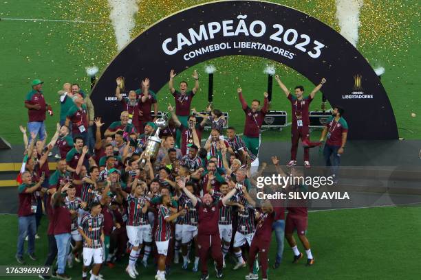 Players of Fluminense celebrate with the trophy after winning the Copa Libertadores final football match between Brazil's Fluminense and Argentina's...