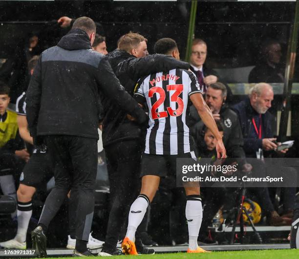 Newcastle United manager Eddie Howe hugs an injured Jacob Murphy during the Premier League match between Newcastle United and Arsenal FC at St. James...