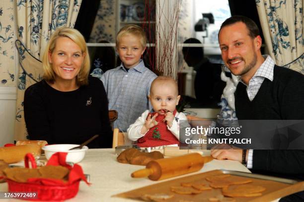 Norway's Crown Princess Mette-Marit , her son Marius, Princess Ingrid Alexandra and Crown Prince Haakon prepare Christmas cakes in their home Skaugum...