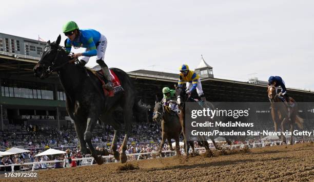 Arcadia, CA Jockey Brad Ortiz Jr., left, riding Goodnight Olive wins the Breeders Cup Filly & Mare Sprint during the Breeders Cup 2023 World...