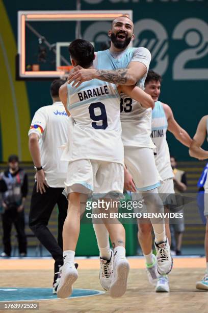 Players of Argentina celebrate after defeating Venezuela and winning the gold medal in the basketball men's team finals gold medal match between...