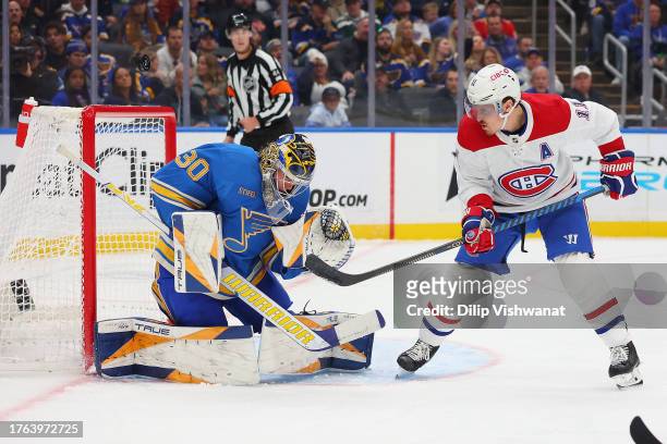 Joel Hofer of the St. Louis Blues makes a save against Brendan Gallagher of the Montreal Canadiens during the second period at Enterprise Center on...