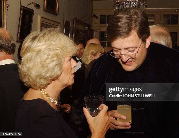 Camilla Parker-Bowles speaks with actor Stephen Fry at a reception at Clarence House, the Prince of Wales' official London residence, where celebrity...