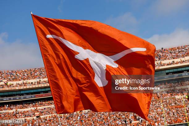 The Texas Longhorns flag flies after a touchdown during the game between the Texas Longhorns and the Kansas State Wildcats on November 4, 2023 at...