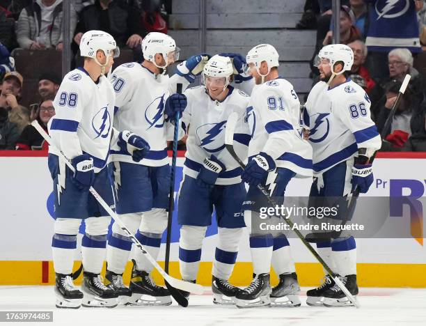 Brayden Point of the Tampa Bay Lightning celebrates his third period goal and third of the game against the Ottawa Senators with teammates Mikhail...