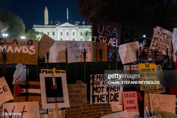 Signs are left in Lafayette Square across from the White House following a rally in support of Palestinians in Washington, DC, on November 4, 2023....