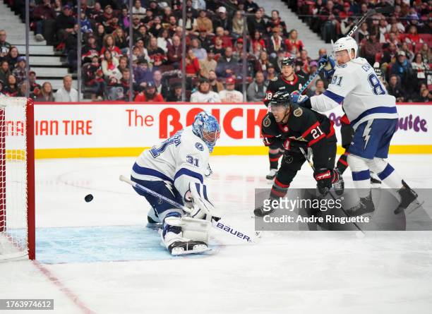 The puck hits the back of the net behind Jonas Johansson of the Tampa Bay Lightning after a shot from Claude Giroux of the Ottawa Senators goes in as...