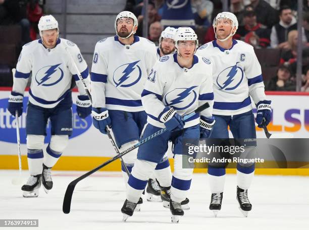 Brayden Point of the Tampa Bay Lightning celebrates his third period goal and third of the game against the Ottawa Senators with teammates Mikhail...