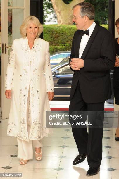 The Duchess of Cornwall and French Ambassador to Britain Maurice Gourdault-Montagne arrive to a reception for Le Dispensaire Francais in London, on...