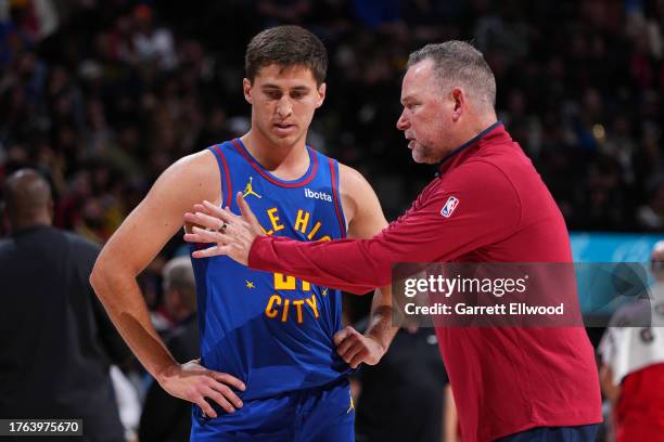 Collin Gillespie and Head Coach Michael Malone of the Denver Nuggets talk during the game against the Chicago Bulls on November 4, 2023 at the Ball...