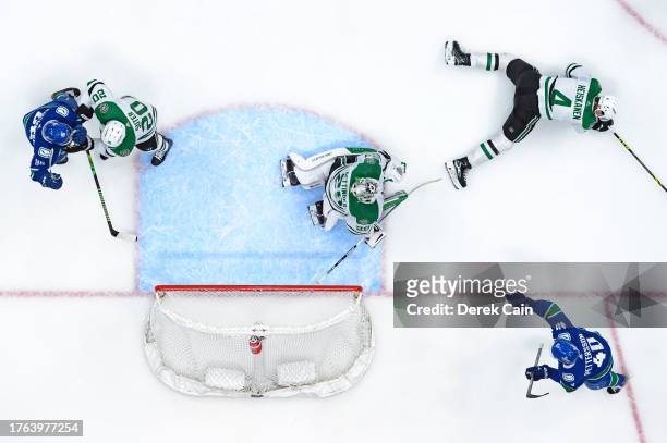 Elias Pettersson of the Vancouver Canucks celebrates after scoring a goal on Jake Oettinger of the Dallas Stars during the second period of their NHL...