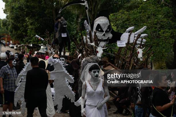 Young people decorate a haunted cart during the traditional Calabiuza Festival in Tonacatepeque, on November 04, 2023 in San Salvador, El Salvador....