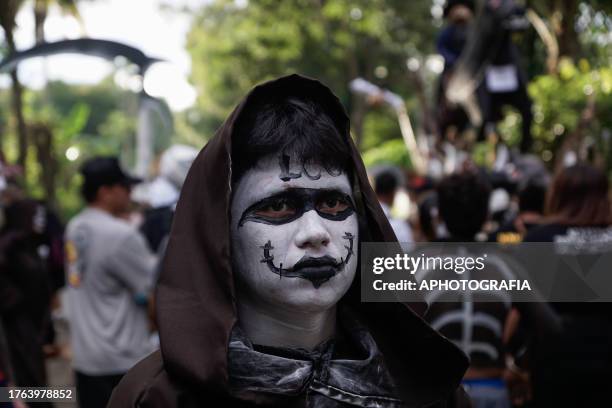 Young man in a costume and painted face during the traditional Calabiuza Festival in Tonacatepeque, on November 04, 2023 in San Salvador, El...