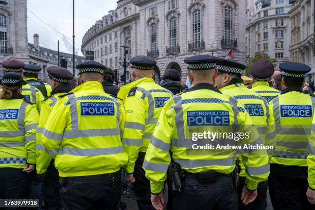 Officers from the Metropolitan police start to arrest the peaceful protestors staging a sit in calling for an immediate ceasefire in Gaza on the 4th...