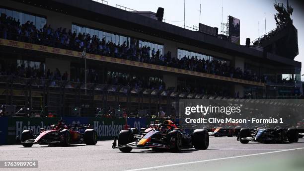 Max Verstappen of the Netherlands driving the Oracle Red Bull Racing RB19 leads the field at the restart after a red flag delay during the F1 Grand...