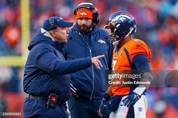 Russell Wilson of the Denver Broncos talks with head coach Sean Payton of the Denver Broncos during the fourth quarter of a game against the Kansas...